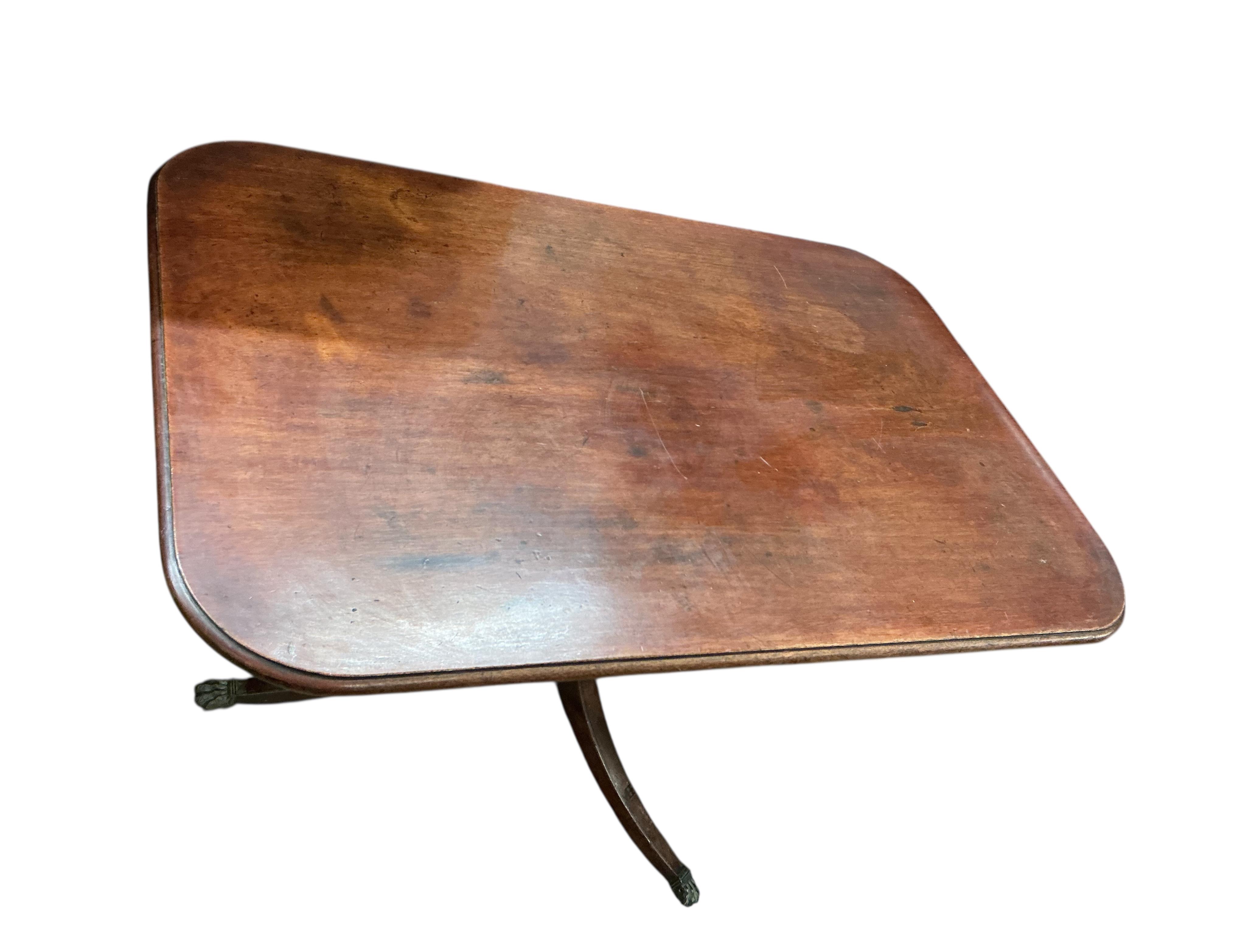 A Regency rectangular mahogany tilt top tripod dining table, width 114cm, depth 76cm, height 72cm
